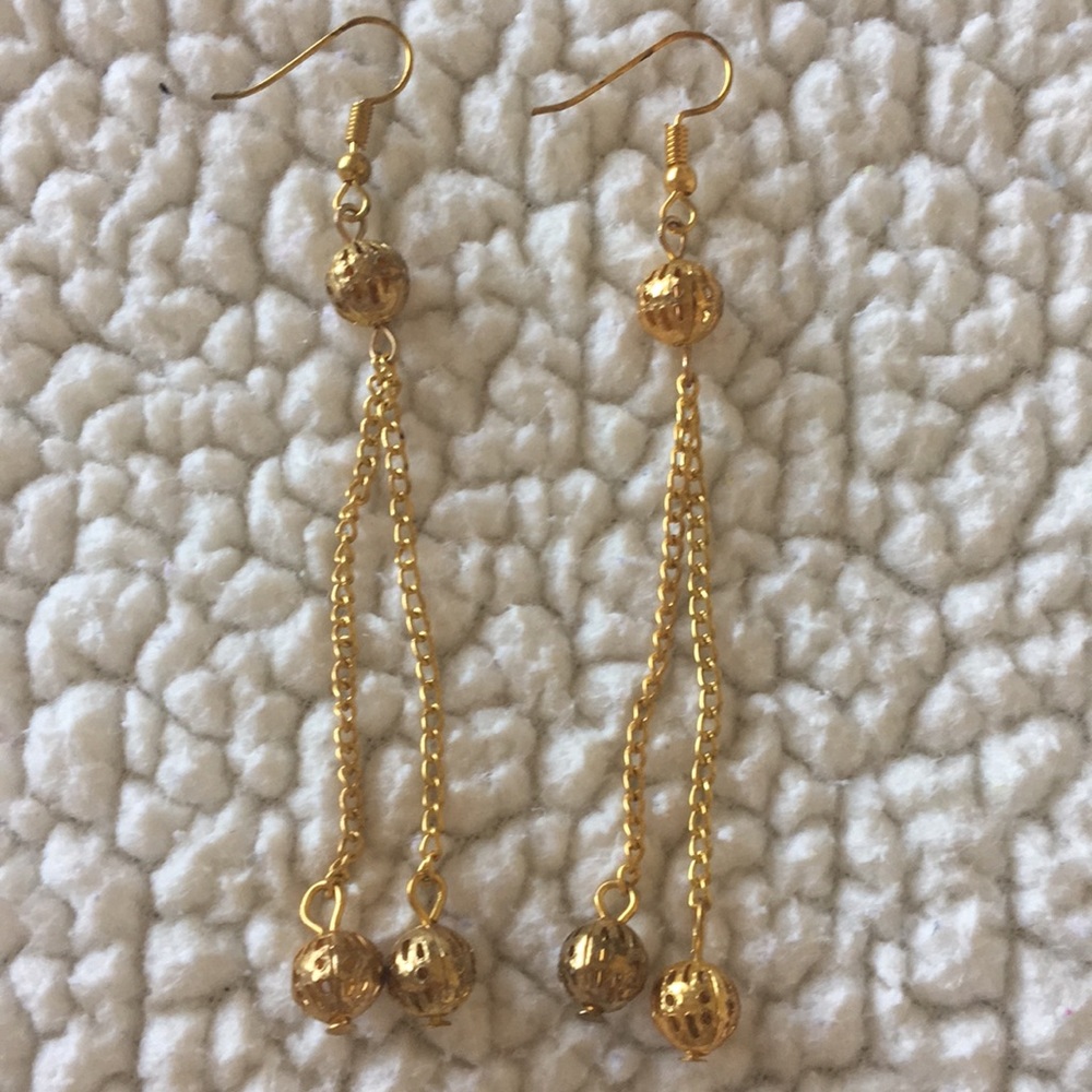 Pair of gold colored earrings